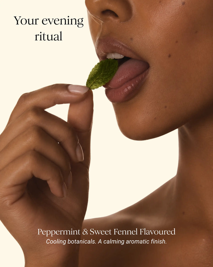 Close-up of a woman's hand and lower face holding a mint leaf near her lips, with text reading 'Your evening ritual' and 'Peppermint & Sweet Fennel Flavoured Cooling botanicals. A calming aromatic finish.