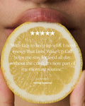 A close-up of a person holding a lemon slice in front of their mouth, with a five-star rating graphic and a customer testimonial quote overlaid in white text on the lemon.